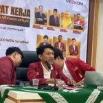 Ketua PC IMM Kota Gorontalo Yunus Pasau saat memimpin Rapat Kerja Cabang IMM di aula kantor Disparekrafpora Prov. Gorontalo. (Foto: Annahdlah)